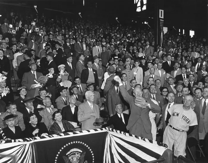 Framed Print : President Eisenhower throwing out the first ball of the 1954 Baseball season at Griffith Stadium. At left is Casey Stengel in the New York Yankees uniform Framed Print : President Eisenhower throwing out the first ball of the 1954 Baseball season at Griffith Stadium. At left is Casey Stengel in the New York Yankees uniform