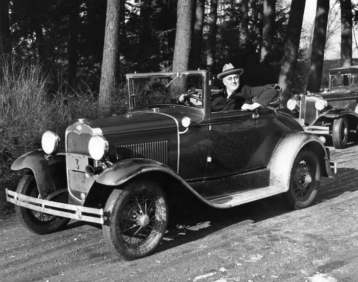 Framed Print : President-elect Franklin Roosevelt driving at Hyde Park, NY. His car was designed with hand controls replacing foot pedals, so he could drive in spite of his paralyzed legs. Jan Framed Print : President-elect Franklin Roosevelt driving at Hyde Park, NY. His car was designed with hand controls replacing foot pedals, so he could drive in spite of his paralyzed legs. Jan