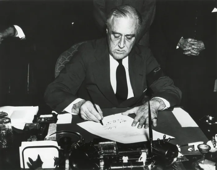 Framed Print : President Franklin Roosevelt signing the declaration of war against Japan. He wears a black armband in mourning for his recently deceased mother. Dec. 8, 1941. (BSLOC_2013_11_153)