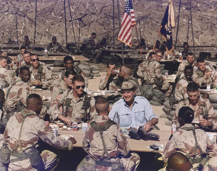 Framed Print : President George Bush having Thanksgiving dinner with U.S. troops in Saudi Arabia. Nov. 22 1990. (BSLOC_2011_3_81)