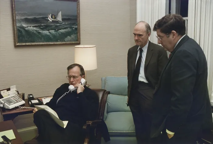 Framed Print : President George Bush in a telephone conference regarding the Panama invasion on Dec. 20 1989. With him in the Oval Office Study are Gen. Brent Scowcroft and John Sununu Framed Print : President George Bush in a telephone conference regarding the Panama invasion on Dec. 20 1989. With him in the Oval Office Study are Gen. Brent Scowcroft and John Sununu