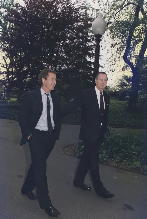 Framed Print : President George H.W. Bush walks on White House grounds with his son George W. Bush then head of an investment group that owned the Texas Rangers Baseball team. April 29 1992 Framed Print : President George H.W. Bush walks on White House grounds with his son George W. Bush then head of an investment group that owned the Texas Rangers Baseball team. April 29 1992