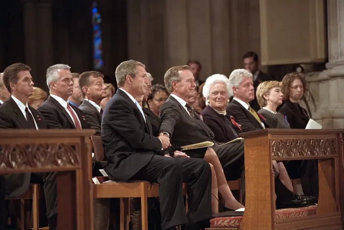 Framed Print : President George W. Bush grasps the hand of his father, former President George H. W. Bush
