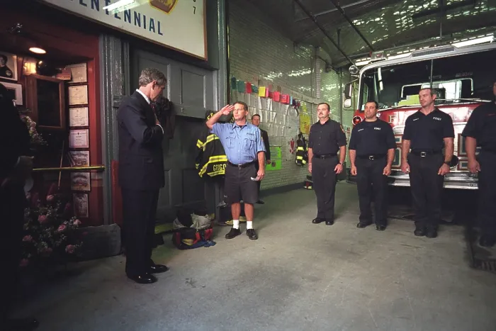 Framed Print : President George W. Bush visits with firefighters at Engine Co. 55 in New York City. Located in Little Italy, the company lost 8 men in the 9-11 Terrorist attacks. Oct. 3, 2001