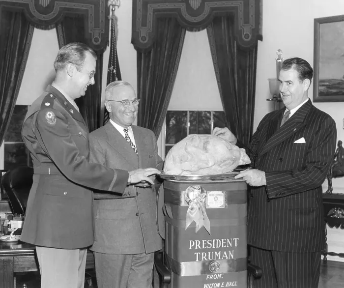 Framed Print : President Harry Truman accepts a turkey from Senator Olin Johnston of South Carolina. L-R: Colonel Lewis Jackson, President Truman, Senator Johnston. Nov. 25, 1946