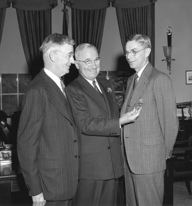 Framed Print : President Harry Truman, center, presenting chemist Dr. James Conant with the Medal of Merit and Bronze Oak Leaf Cluster. Dr. Vannevar Bush stands at left