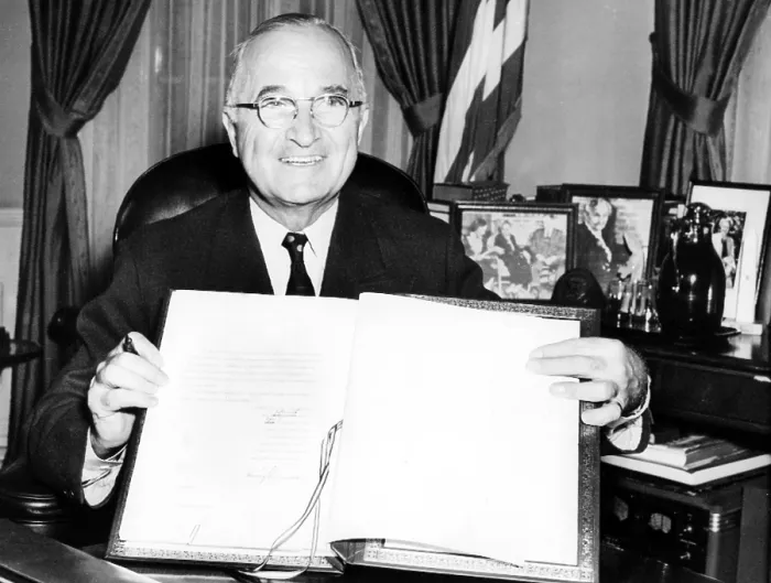 Framed Print : PRESIDENT HARRY TRUMAN holds up the Japanese peace treaty he signed into ratification, 4 / 15 / 52.. Courtesy: CSU Archives  /  Everett Collection