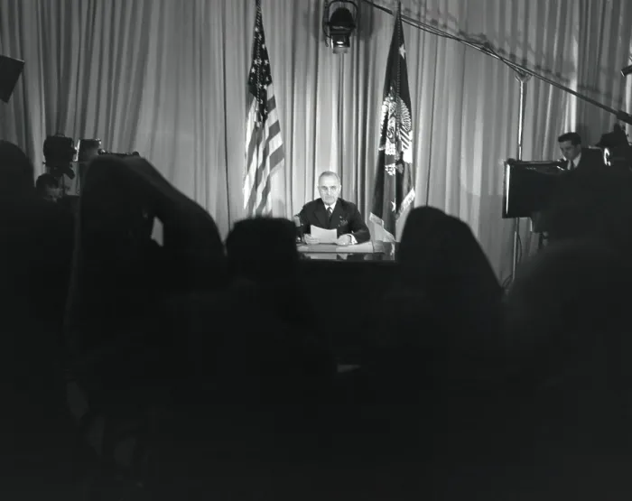Framed Print : President Harry Truman seated at his desk with lights on and cameras rolling. He was announcing that World War 2 in Europe had ended. May 9, 1845. - (BSLOC_2014_15_18)