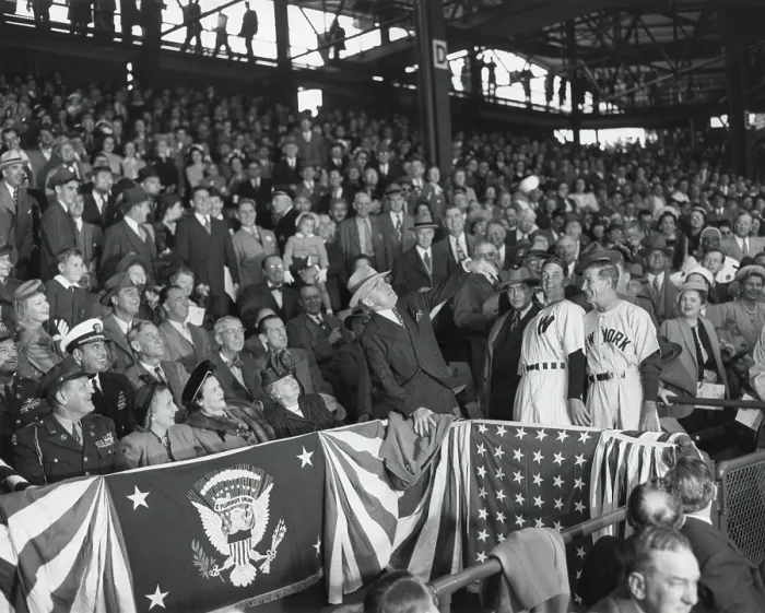Framed Print : President Harry Truman tosses a baseball from the stands to open the season. Front row, L-R: Gen. Harry Vaughan; Margaret Truman; Evlyn Snyder; Bess Truman, and President Truman
