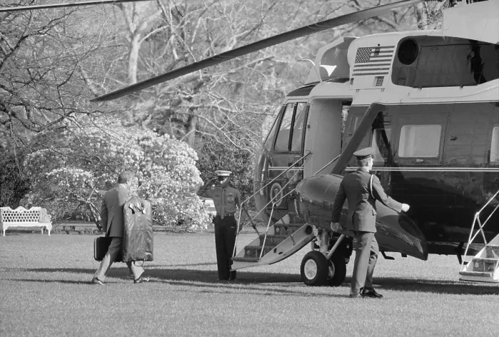 Framed Print : President Jimmy Carter walking toward Marine 1 the Presidential helicopter carrying his own luggage. Ca. 1977-80