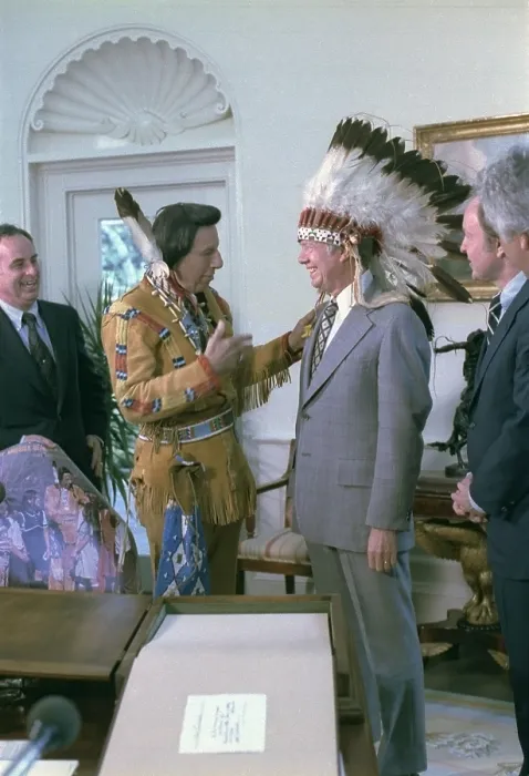 Framed Print : President Jimmy Carter wearing a feathered headdress presented to him by Iron Eyes Cody 1904-1999 an actor Framed Print : President Jimmy Carter wearing a feathered headdress presented to him by Iron Eyes Cody 1904-1999 an actor