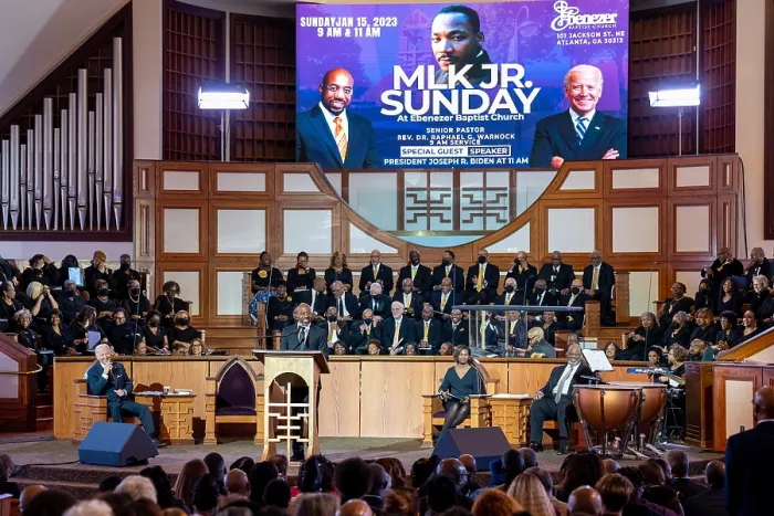 Framed Print : President Joe Biden listens as Sen. Raphael Warnock, the head pastor of Ebenezer Baptist Church speaks in the New Horizon Sanctuary, Jan. 15, 2023