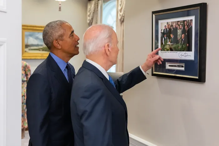 Framed Print : President Joe Biden and former President Barack Obama reminisce by a framed photo of President Obama signing the Affordable Care Act, on March 23, 2010 Framed Print : President Joe Biden and former President Barack Obama reminisce by a framed photo of President Obama signing the Affordable Care Act, on March 23, 2010