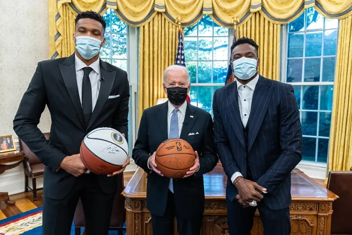 Framed Print : President Joe Biden signs a basketball and records a video message with Giannis Antetokounmpo and Thanasis Antetokounmpo of the 2021 NBA Champion Milwaukee Bucks, Nov