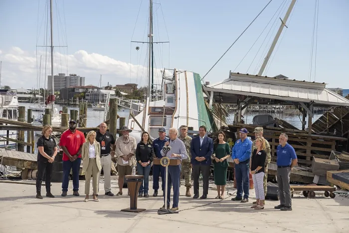 Framed Print : President Joe Biden speaks on recovery efforts after Hurricane Ian, at Fisherman's Wharf in Fort Myers, Oct. 5, 2022. Standing behind to the right are Florida Gov
