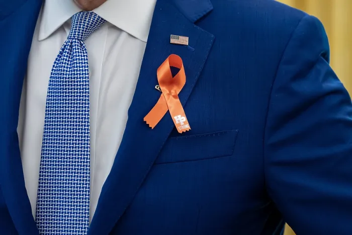 Framed Print : President Joe Biden, wears an orange ribbon for gun violence awareness. The color was chosen in memory of 15-year-old, Hadiya Pendleton, whose favorite color was orange