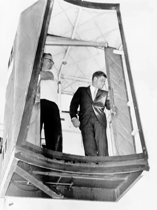 Framed Print : President John F. Kennedy riding a lift, called a cherry picker, to board plane flying from West Palm Beach, Fla. back to Washington, D.C