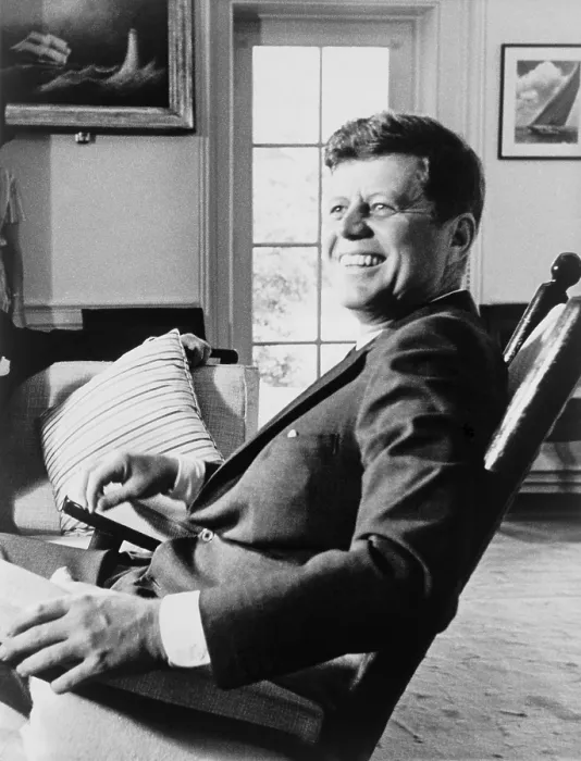 Framed Print : President John F. Kennedy in rocking chair on his 43rd birthday. May 29, 1963