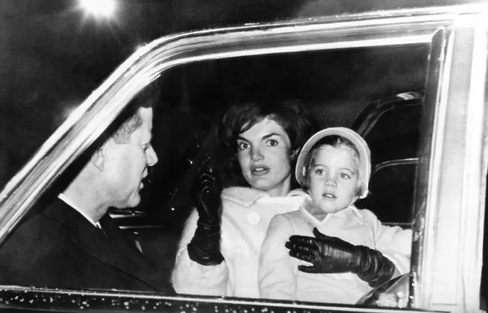 Framed Print : President John and Jacqueline Kennedy in a limousine with their four year old daughter Caroline