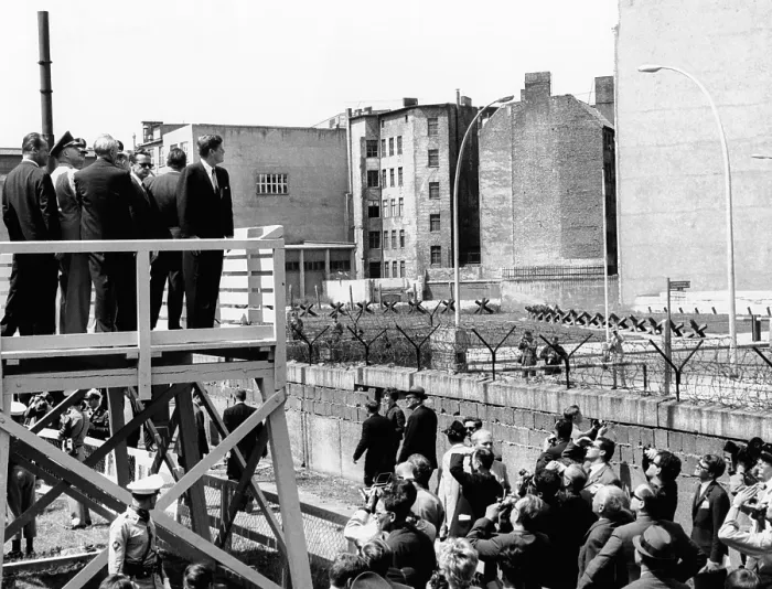 Framed Print : President John Kennedy in Berlin. On a specially erected platform, JFK views the communist wall which separates East and West Berlin. July 26, 1963 Framed Print : President John Kennedy in Berlin. On a specially erected platform, JFK views the communist wall which separates East and West Berlin. July 26, 1963