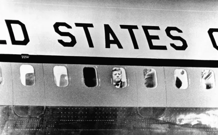 Framed Print : President John Kennedy peers out from window of Air Force One. He was leaving for Paris to meet with French President de Gaulle and then with Soviet Premier Khrushchev in Vienna