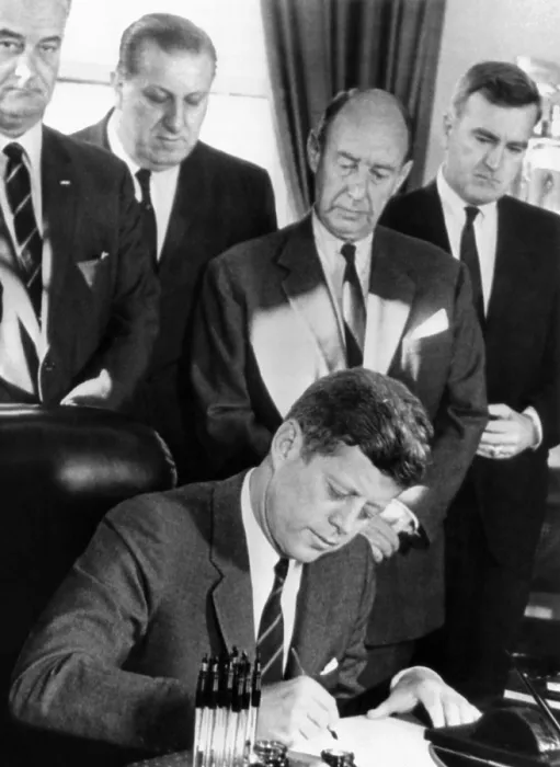 Framed Print : President John Kennedy signs a bill allowing the US to purchase half of the United Nations $200 million bonds. Witnessing L-R: Vice Pres. Lyndon Johnson; Rep