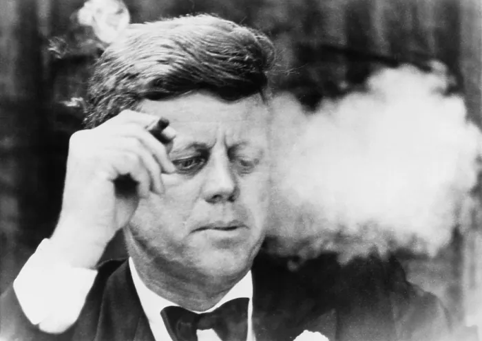 Framed Print : President John Kennedy, smoking a small cigar at a Democratic fundraiser in Boston's Commonwealth Armory. Oct. 19, 1963 Framed Print : President John Kennedy, smoking a small cigar at a Democratic fundraiser in Boston's Commonwealth Armory. Oct. 19, 1963