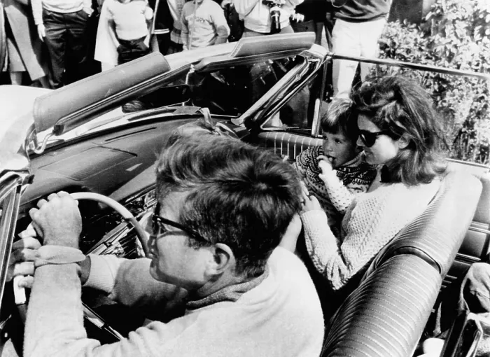 Framed Print : President Kennedy drives an open car in Newport, Rhode Island, leaving for a Narragansett Bay cruise aboard the Kennedy family yacht Framed Print : President Kennedy drives an open car in Newport, Rhode Island, leaving for a Narragansett Bay cruise aboard the Kennedy family yacht