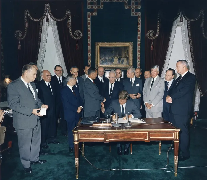 Framed Print : President Kennedy signing the Nuclear Test Ban Treaty which banned nuclear tests in the atmosphere, underwater and in space