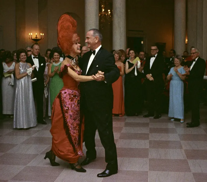 Framed Print : President Lyndon Johnson dancing with Carol Channing. Channing wears her costume from an earlier White House performance of the popular Broadway musical, Hello Dolly Framed Print : President Lyndon Johnson dancing with Carol Channing. Channing wears her costume from an earlier White House performance of the popular Broadway musical, Hello Dolly