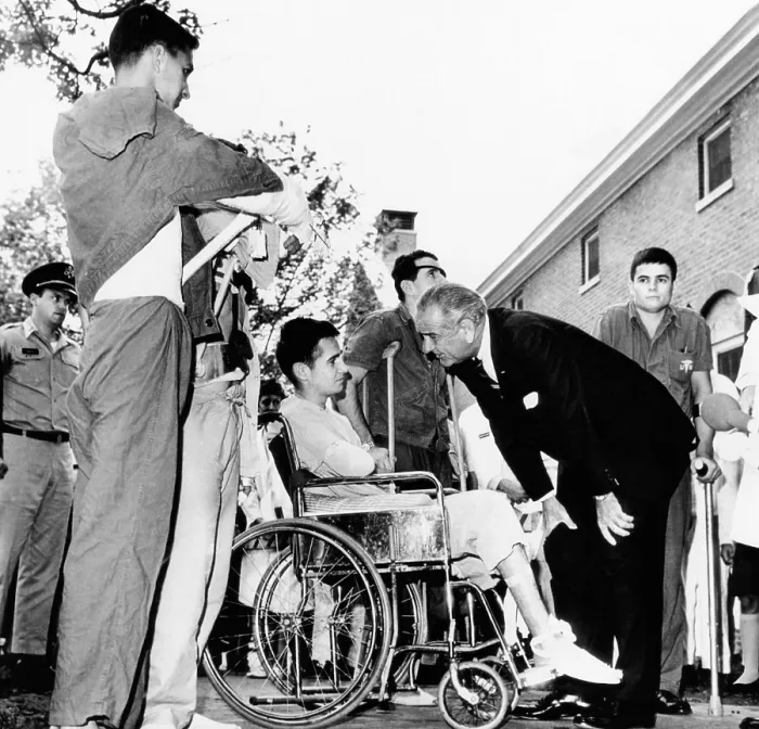 Framed Print : President Lyndon Johnson greets wounded veterans at Walter Reed Hospital. L-R: SSgt. Robert C. Meier; SP / 4 James G. Hartwick; E / 5 Thomas Beil; and SP / 4 James R. Tyree