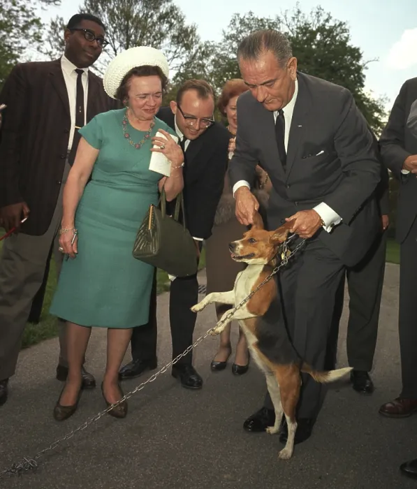 Framed Print : President Lyndon Johnson holds his beagle up by the ears as members of the press look on. May 4, 1964