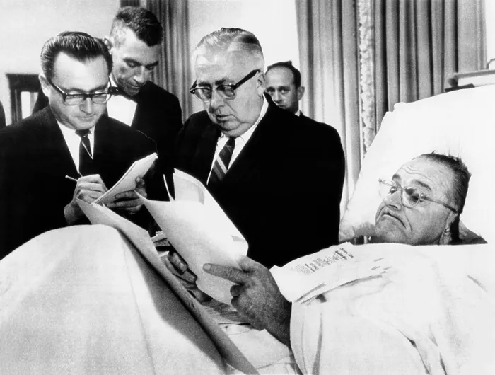 Framed Print : President Lyndon Johnson working in bed after gall bladder surgery. President Johnson looks over documents in his hospital bed at Bethesda Naval Hospital as newsmen look on. Nov Framed Print : President Lyndon Johnson working in bed after gall bladder surgery. President Johnson looks over documents in his hospital bed at Bethesda Naval Hospital as newsmen look on. Nov