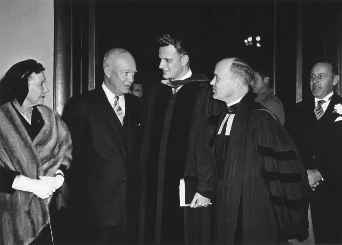 Framed Print : President and Mamie Eisenhower leaving National Presbyterian Church, March 6, 1955. Eisenhower speaks with Evangelist Billy Graham. L-R: First Lady, the President, Rev