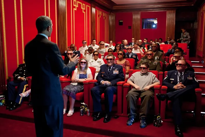 Framed Print : President Obama welcomes service members and their families to the White House Family Theater. They are prepared to watch the 3-D movie, MEN IN BLACK 3, May 25, 2012