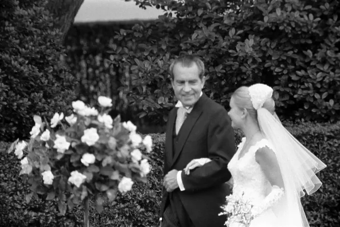 Framed Print : President Richard Nixon escorting daughter Tricia Nixon at her wedding at the White House. Tricia dress was designed by Priscilla of Boston. June 12 1971