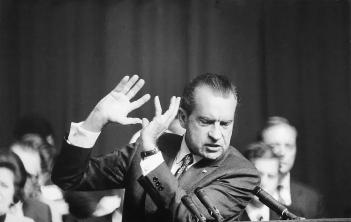Framed Print : President Richard Nixon gesturing with his hands while speaking. Ca. 1969-74
