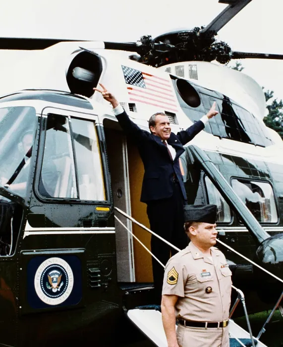 Framed Print : President Richard Nixon makes his two-armed victory gesture from Army One, the helicopter taking him from the White House on August 9, 1974, after his forced resignation