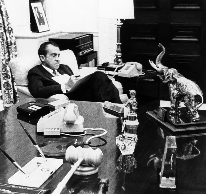 Framed Print : President Richard Nixon in his office in the White House residence. On the desk are souvenirs from his long political career. Between 1969-Jan. 1971 Framed Print : President Richard Nixon in his office in the White House residence. On the desk are souvenirs from his long political career. Between 1969-Jan. 1971