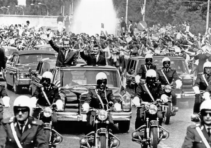 Framed Print : President Richard Nixon and President Nicolae Ceausescu wave to huge, flag-waving crowd during motorcade in Bucharest, Romania