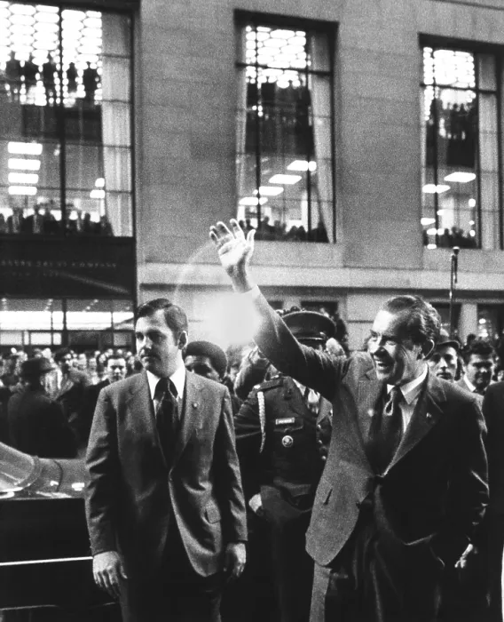 Framed Print : President Richard Nixon waves to crowd on Broad Street in the Financial District of NYC. Nov. 24, 1972. At left is Press Secretary Ron Ziegler