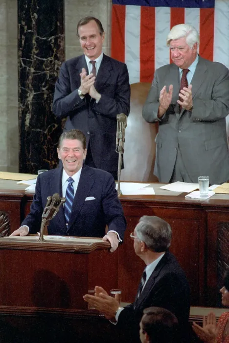 Framed Print : President Ronald Reagan addresses Congress on April 28, 1981, a few weeks after surviving an assassination attempt. Behind the President is VP George H.W Framed Print : President Ronald Reagan addresses Congress on April 28, 1981, a few weeks after surviving an assassination attempt. Behind the President is VP George H.W