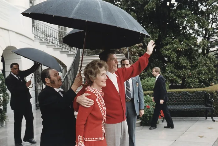 Framed Print : President Ronald Reagan and First Lady Nancy Reagan wave from the White House after President Reagan's return from the hospital. Washington, D.C. April 11, 1981