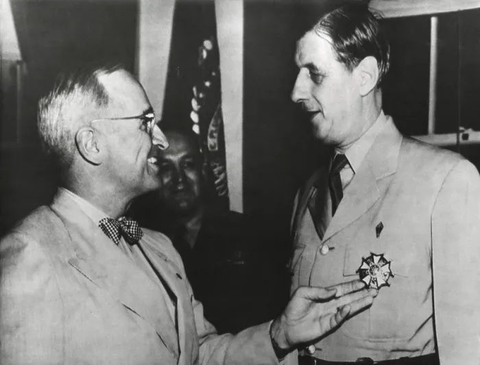 Framed Print : President Truman admires the Legion of Merit Degree Medal he has just awarded Charles De Gaulle. Outside this ceremony, their August 1945 meetings were tense