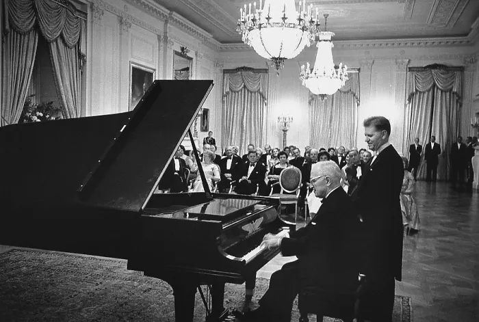 Framed Print : Former President Truman plays the White House piano in the East Room as master pianist Eugene List awaits his turn Framed Print : Former President Truman plays the White House piano in the East Room as master pianist Eugene List awaits his turn