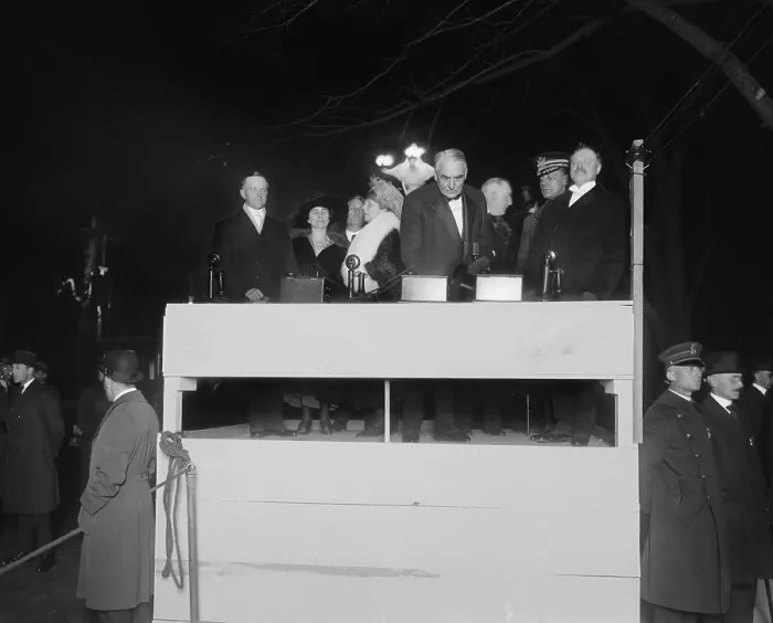 Framed Print : President Warren Harding pressing a ceremonial electric button. With him on the simple wooden podium is First Lady Florence Harding, Vice President Calvin and Grace Coolidge. Ca