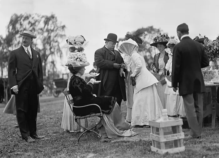 Framed Print : President William Howard Taft standing to greet guest at a White House garden party, c. 1911. Seated near the President is First Lady Helen Taft Framed Print : President William Howard Taft standing to greet guest at a White House garden party, c. 1911. Seated near the President is First Lady Helen Taft