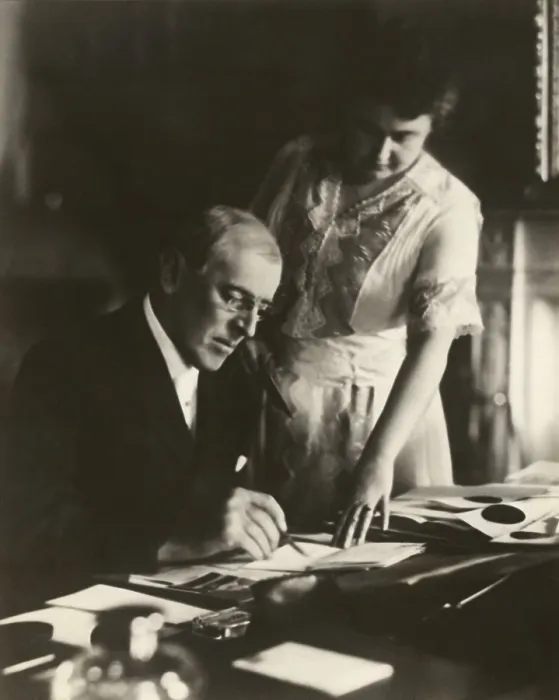 Framed Print : President Woodrow Wilson, at his White House desk, with his wife, Edith Bolling Galt, at his side