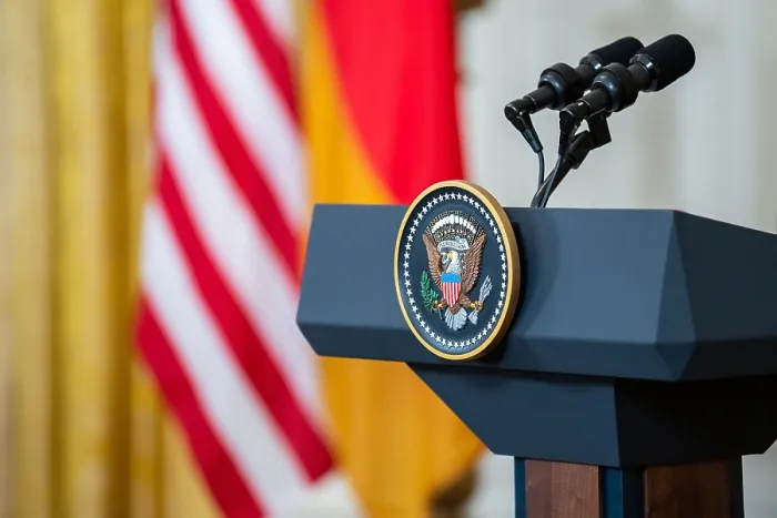 Framed Print : The US presidential seal hangs from a speakerless podium in East Room of the White House, Feb. 7, 2022 (BSLOC_2022_2_2)