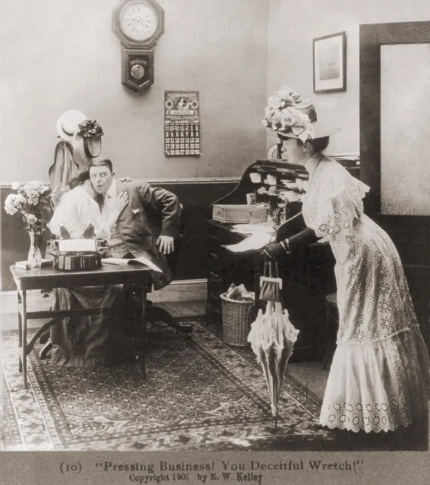 Framed Print : PRESSING BUSINESS YOU DECIETFUL WRETCH Is the caption to a photo of a woman surprising husband who is embracing secretary in his office. Ca. 1907. (BSLOC_2010_18_88)